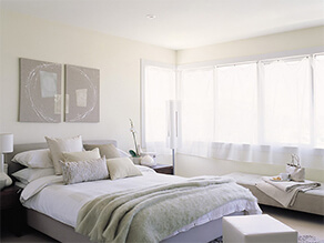 Light White Neutral Themed Greyish Bedroom with Artwork above the bed